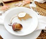 <p>All you need is some corrugated cardstock paper, autumn leaves, an acorn ornament, and some twine to make these adorably rustic place cards.</p><p><strong><em><a href="https://madeinaday.com/corrugated-leaf-place-cards-turkeytablescapes/" rel="nofollow noopener" target="_blank" data-ylk="slk:Get the tutorial at Made in a Day;elm:context_link;itc:0;sec:content-canvas" class="link ">Get the tutorial at Made in a Day</a>. </em></strong></p><p><a class="link " href="https://www.amazon.com/Felted-Acorns-Acorn-Ornaments-Colors/dp/B01GFYWNZY?tag=syn-yahoo-20&ascsubtag=%5Bartid%7C10070.g.2668%5Bsrc%7Cyahoo-us" rel="nofollow noopener" target="_blank" data-ylk="slk:SHOP ACORN ORNAMENTS;elm:context_link;itc:0;sec:content-canvas">SHOP ACORN ORNAMENTS</a></p>
