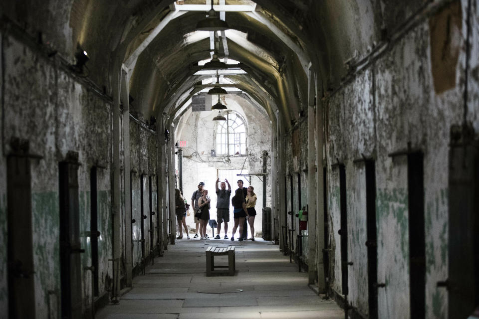 Tourist visit a cellblock of the Eastern State Penitentiary, Thursday, May 2, 2019, which is now a museum in Philadelphia. (AP Photo/Matt Rourke)