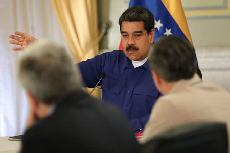 Venezuela's President Nicolas Maduro speaks during a meeting with ministers at Miraflores Palace in Caracas, Venezuela July 25, 2018. Miraflores Palace/Handout via REUTERS