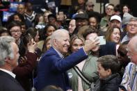 Democratic presidential candidate former Vice President Joe Biden takes photos with supporters at a campaign event at Saint Augustine's University in Raleigh, N.C., Saturday, Feb. 29, 2020. (AP Photo/Gerry Broome)