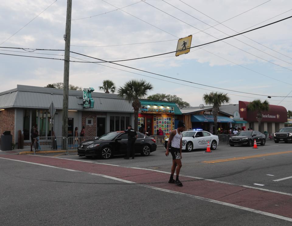 Law enforcement officers pull over a vehicle on Saturday, April 20, 2024 during Orange Crush on Tybee Island.