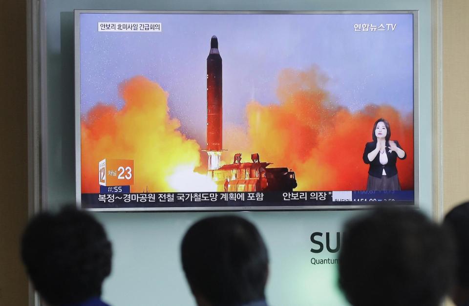 FILE - In this June 23, 2016, file photo, people watch a TV news channel airing an image of North Korea's ballistic missile launch published in North Korea's Rodong Sinmun newspaper at the Seoul Railway Station in Seoul, South Korea. North Korea on Monday, March 6, 2017, fired "several" banned ballistic missiles that flew about 1,000 kilometers (620 miles) into waters off its east coast, South Korea's military said, an apparent reaction to huge military drills by Washington and Seoul that Pyongyang insists are an invasion rehearsal.(AP Photo/Ahn Young-joon, File)