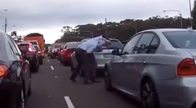 The men could be seen grappling with one another. Source: Facebook/ DashCam Owners Australia