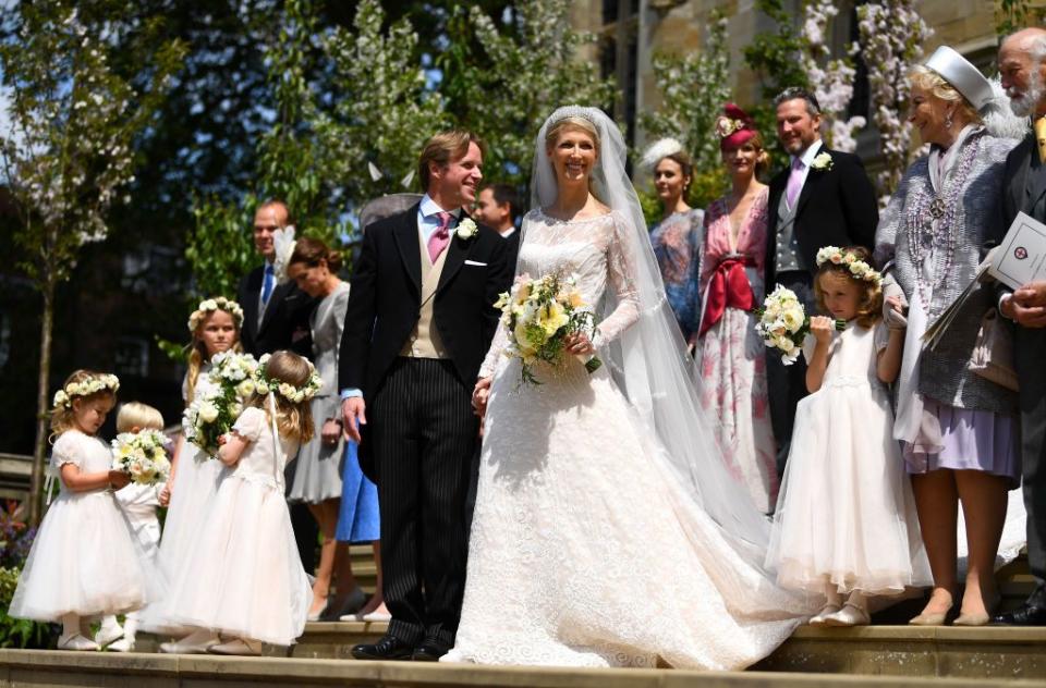 The newlyweds pose with their wedding party