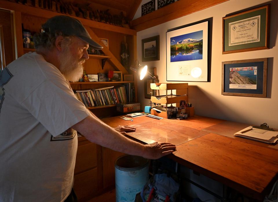 Will French looks at his certificates from hiking the Appalachian Trail in 1998 and, recently, the International Appalachian Trail.