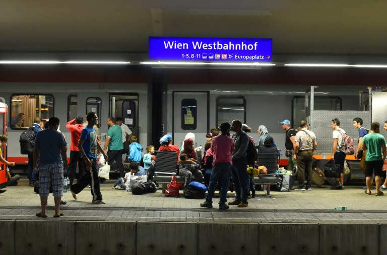 Migrants rest on a platform at Vienna's Westbahnhof railway station in the early hours of September 1, 2015