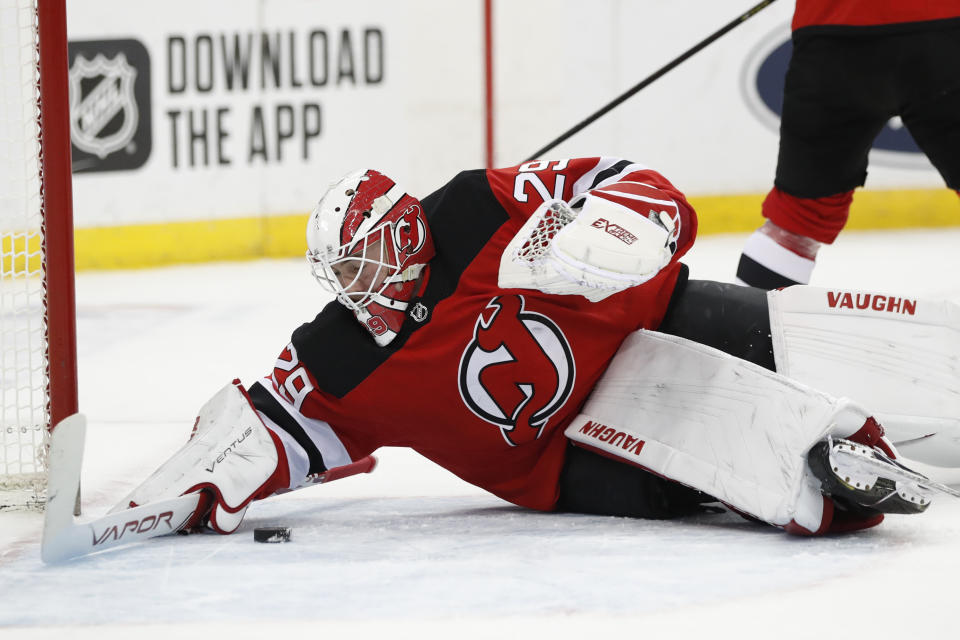 New Jersey Devils goaltender Mackenzie Blackwood (29) makes a save during the first period of an NHL hockey game against the Columbus Blue Jackets, Sunday, Feb. 16, 2020, in Newark, N.J. (AP Photo/Kathy Willens)