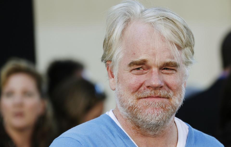 U.S. actor Philip Seymour Hoffman, who stars as Oakland Athletics' manager Art Howe, arrives for the world premiere of the film "Moneyball" in Oakland, California in this September 19, 2011, file photo. Award-winning actor Philip Seymour Hoffman was found dead in his apartment in New York City on Sunday, the Wall Street Journal reported, citing a law-enforcement official, February 2, 2014. REUTERS/Robert Galbraith/Files (UNITED STATES - Tags: ENTERTAINMENT OBITUARY)