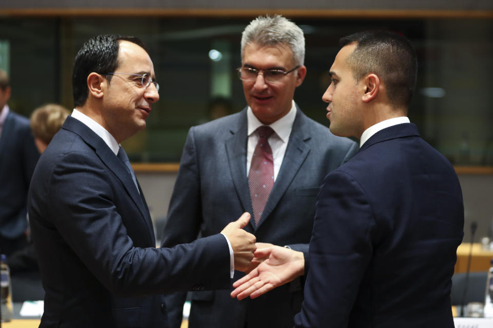 Italian Foreign Minister Luigi Di Maio, right, talks to Cyprus' Foreign Minister Nicos Christodoulides, left, and Malta's Foreign Minister Carmelo Abela during an European Foreign Affairs Ministers meeting at the Europa building in Brussels, Monday, Nov. 11, 2019. European Union foreign ministers are discussing ways to keep the Iran nuclear deal intact after the Islamic Republic began enrichment work at its Fordo power plant. (AP Photo/Francisco Seco)