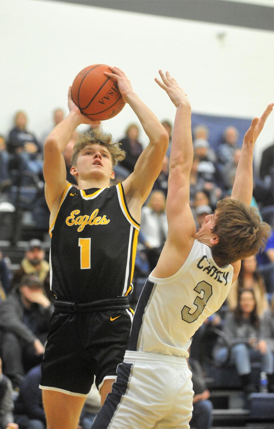 Colonel Crawford's Trevor Vogt shoots over Carey's Carter Smiley.