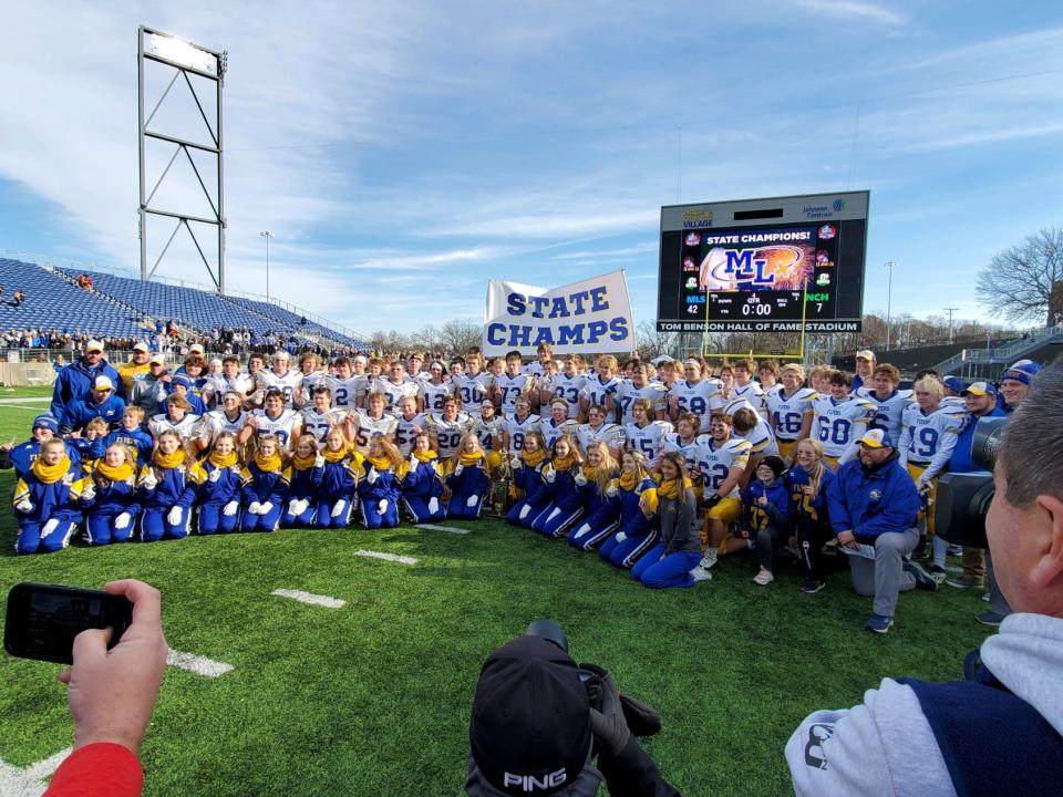 The Marion Local Flyers celebrate their state-record 12th OHSAA football state championship after beating Newark Catholic on Saturday, Dec. 4, 2021, at Tom Benson Hall of Fame Stadium.