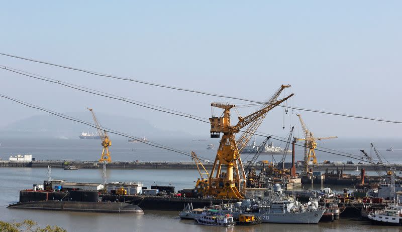 FILE PHOTO: Ships and submarines belonging to the Indian Navy are seen docked at the naval dockyard in Mumbai