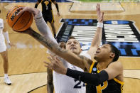 Xavier forward Jack Nunge blocks a shot by Pittsburgh guard Greg Elliott during the first half of a second-round college basketball game in the NCAA Tournament on Sunday, March 19, 2023, in Greensboro, N.C. (AP Photo/Chris Carlson)