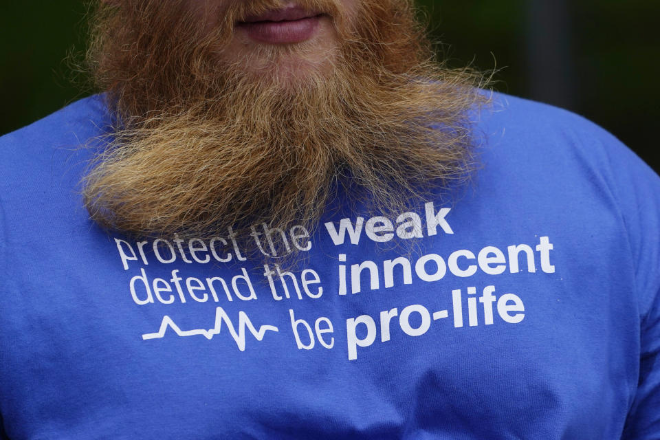 A anti-abortion advocate's t-shirt proclaims his sentiments as he and others set up outside the Jackson Womens Health Organization clinic, Thursday, May 20, 2021, in Jackson, Miss. The clinic is Mississippi's only state licensed abortion facility. On May 17, 2021, the U.S. Supreme Court agreed to take up the dispute over a Mississippi ban on abortions after 15 weeks of pregnancy. The issue is the first test of limits on abortion access to go before the conservative majority high court. Their decision could mean more restrictions, and focuses on the landmark 1973 ruling in Roe v. Wade, which established a woman's right to an abortion. (AP Photo/Rogelio V. Solis)