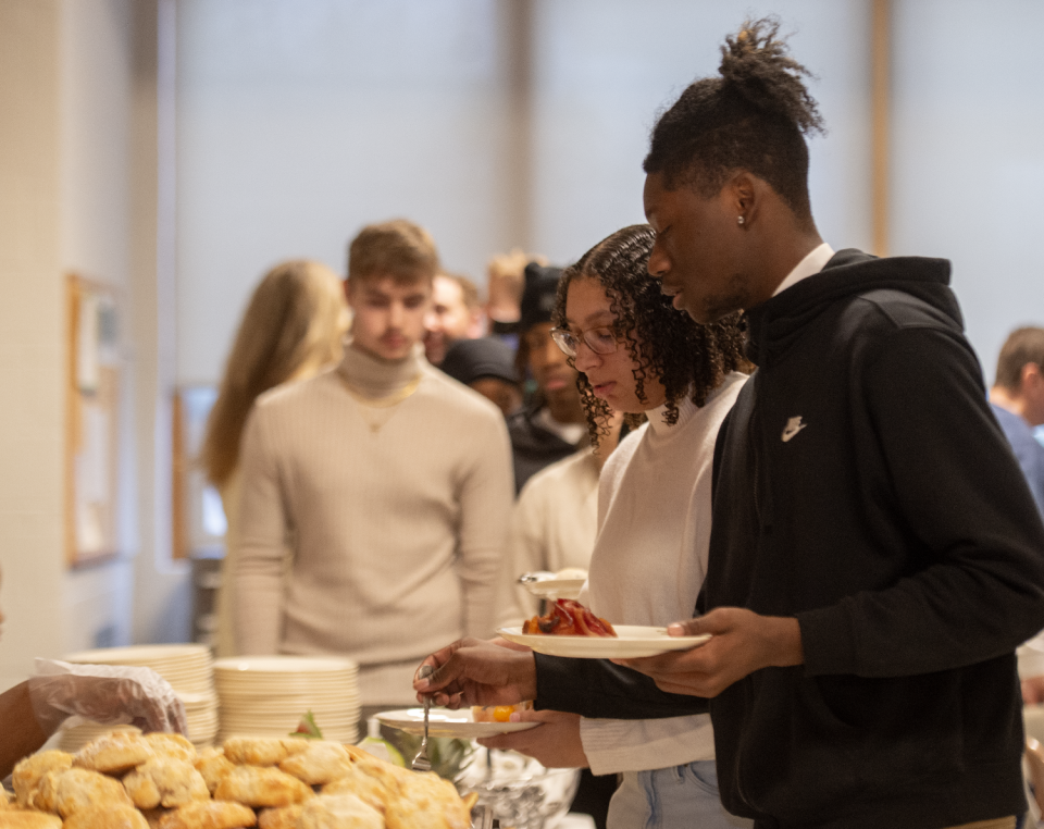 Anthony Wiley, 18, a member of the Windham High School Youth NAACP, gets breakfast at the annual Martin Luther King Jr. Prayer Breakfast on Saturday.