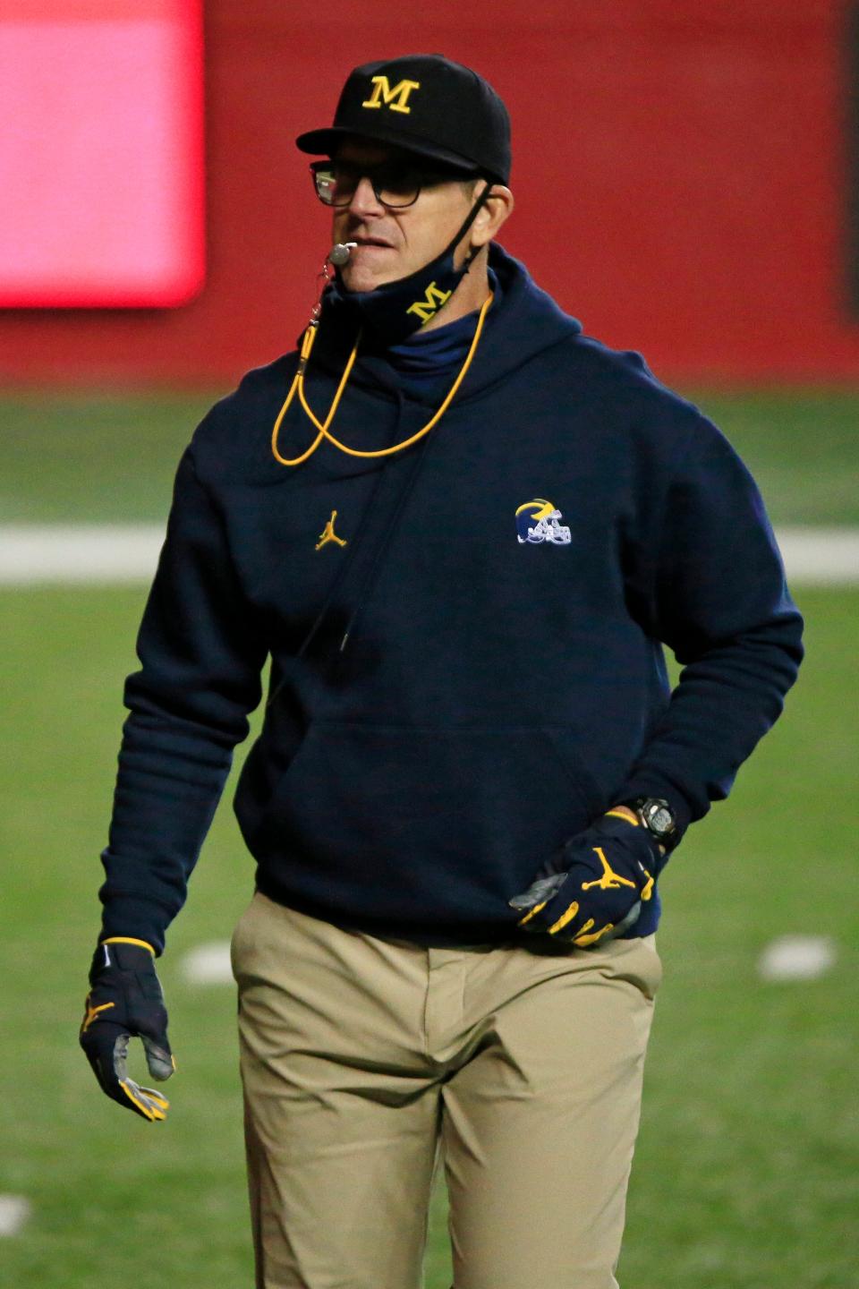Head coach Jim Harbaugh of the Michigan Wolverines warms up his team before the game against the Rutgers Scarlet Knights at SHI Stadium on Nov, 21, 2020 in Piscataway, New Jersey.