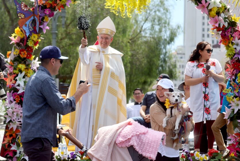 Archbishop Jose H. Gomez tosses holy water during the annual Blessing of the Animals ceremony on April 16 in Los Angeles