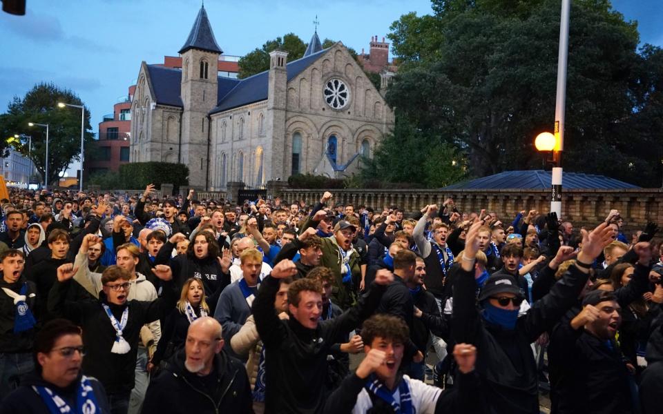 Gent fans march to the ground before the UEFA Conference League match at Stamford Bridge