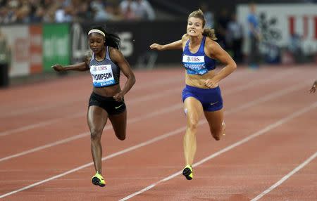 Athletics - IAAF Athletics Diamond League meeting Zurich - Letzigrund stadium, Zurich, Switzerland - 1/9/2016 - Elaine Thompson of Jamaica (L) wins the 200m women ahead of Dafne Schippers of the Netherlands. REUTERS/Ruben Sprich