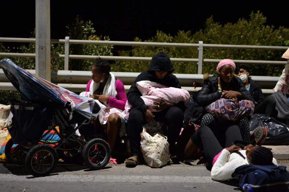 In dramatic scenes overnight, refugees fled fires that broke out at multiple points (AP)