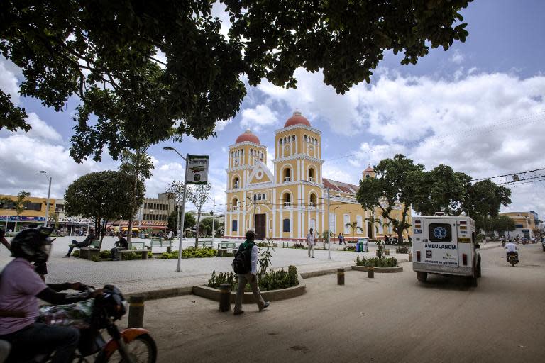 An ambulance passes by the main square of Carmen de Bolivar, Bolivar Province, Colombia, on September 3, 2014