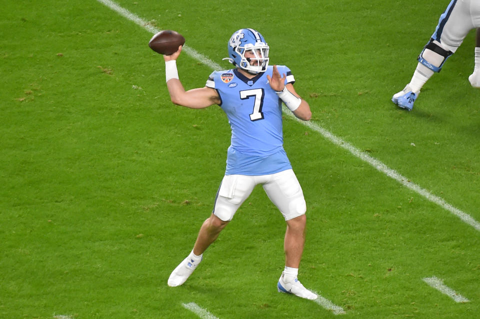 MIAMI GARDENS, FL - JANUARY 02: Sam Howell #7 of the North Carolina Tar Heels drops back to pass during the first quarter of the Capital One Orange Bowl against the Texas A&M Aggies at Hard Rock Stadium on January 2, 2021 in Miami Gardens, Florida. (Photo by Eric Espada/Getty Images)