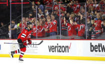 New Jersey Devils defenseman Dougie Hamilton (7) goes to the banch after scoring a goal against the Arizona Coyotes during the second period of an NHL hockey game, Saturday, Nov. 12, 2022, in Newark, N.J. (AP Photo/Noah K. Murray)