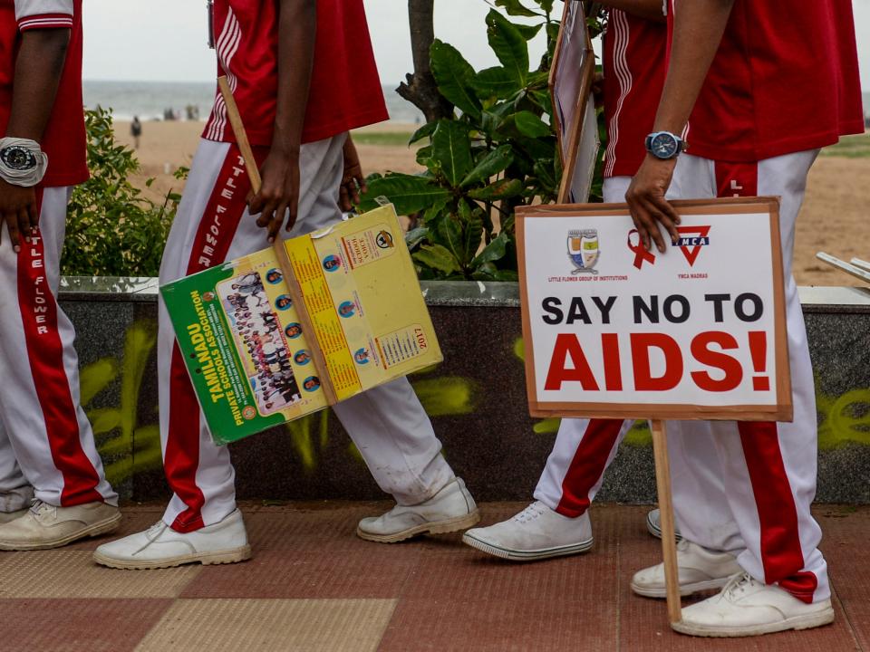 <p>Schoolchildren in Chennai take part in World Aids Day last year</p> (AFP via Getty Images)