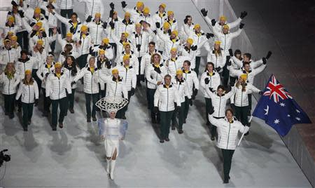 Australia's flag-bearer Alex Pullin leads his country's contingent during the opening ceremony of the 2014 Sochi Winter Olympics, February 7, 2014. REUTERS/Lucy Nicholson