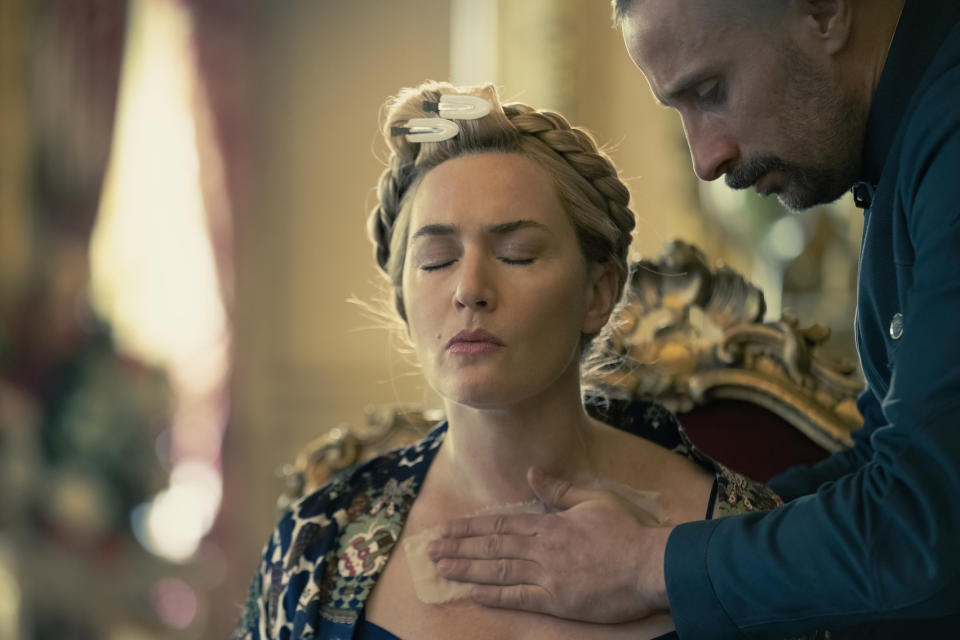 This image released by HBO shows Kate Winslet, left, and Matthias Schoenaerts in a scene from "The Regime." (HBO via AP)