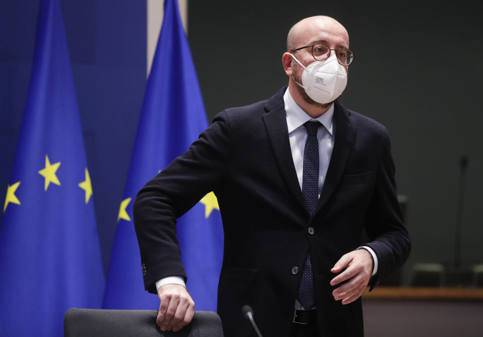 European Council President Charles Michel prepares to take part in an EU Summit, via videoconference link, at the European Council building in Brussels, Thursday, Feb. 25, 2021. European Union leaders are gathering Thursday, via videoconference link, to try to inject new energy into the 27-nation bloc's lagging coronavirus vaccination effort as concern mounts that new variants might spread faster than authorities can adapt. (Olivier Hoslet, Pool via AP)