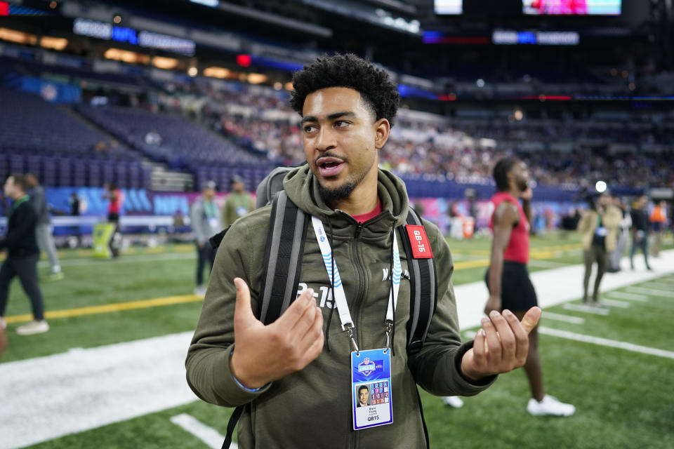 FILE - Alabama quarterback Bryce Young talks on the field during the NFL football scouting combine in Indianapolis, March 4, 2023. The national high school player of the year as a senior in California went on to become the 2021 Heisman Trophy winner as a sophomore at Alabama. (AP Photo/Darron Cummings, File)