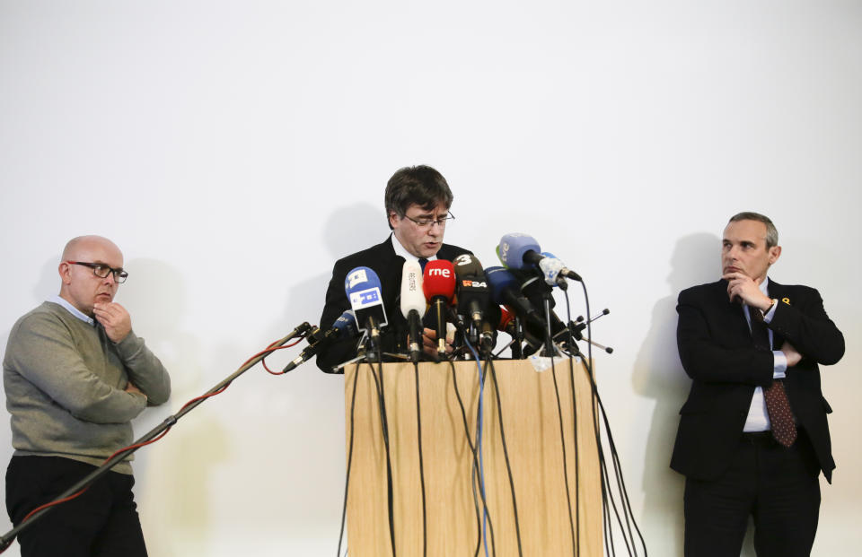 Former Catalan leader Carles Puigdemont, center, is flanked by his lawyer Gonzalo Boye, left, and a staff member right, as he addresses the media during a news conference in Berlin, Germany, Tuesday, Feb. 12, 2019. (Photo/Markus Schreiber)