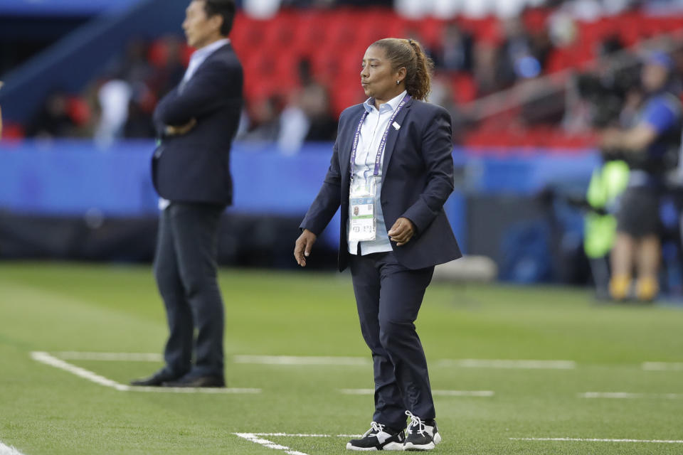 South Africa coach Desiree Ellis, right, and China head coach Jia Xiuquan, background, follow the action during the Women's World Cup Group B soccer match between China and South Africa at Parc des Princes in Paris, France, Thursday, June 13, 2019. (AP Photo/Alessandra Tarantino)