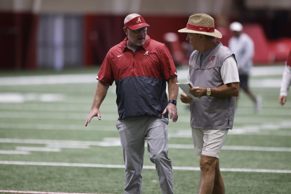 Matt Rhea, left, speaks with Alabama coach Nick Saban. Rhea spent two years with the Crimson Tide before accepting his current position with the New Orleans Saints. | Kent Gidley