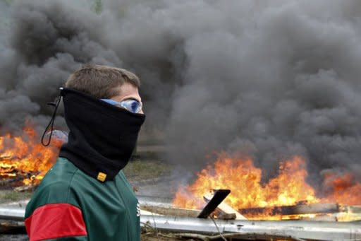 Spanish miners burn tires to cut a road during a miner's demonstration in Caborana, near Oviedo, in northern Spain