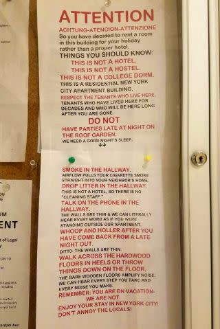 Tenants in Chelsea posted a sign to remind Airbnb guests that they are staying in a residential building.