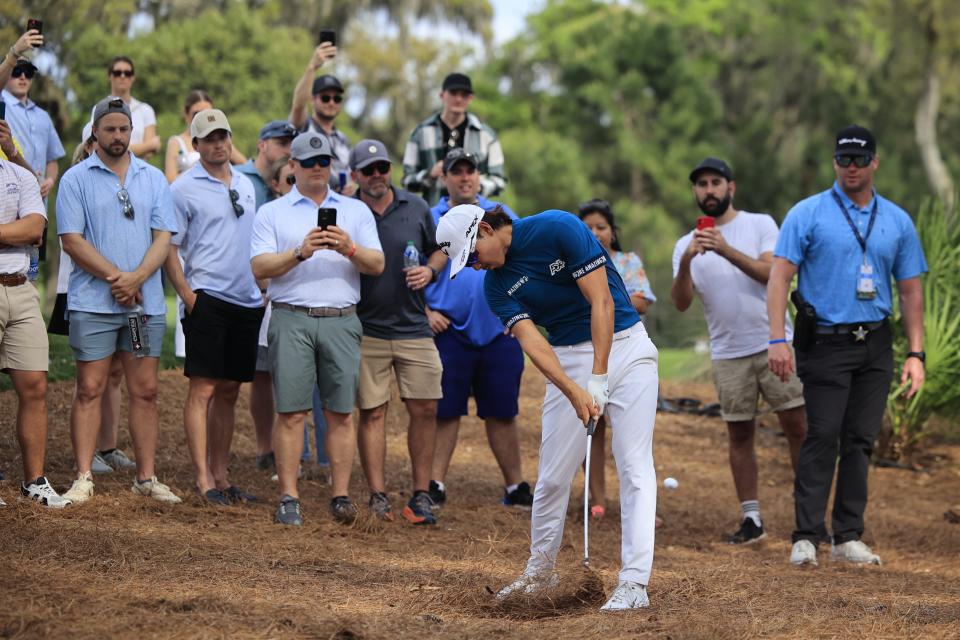 Min Woo Lee hits from the rough on hole 11, which he double bogeyed during the fourth and final round of The Players golf tournament Sunday, March 12, 2023 at TPC Sawgrass in Ponte Vedra Beach, Fla. Scottie Scheffler of Dallas won the tournament at 17 under par with Tyrell Hatton at 12 under par as runner-up. [Corey Perrine/Florida Times-Union]