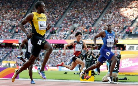 Jamaica's Usain Bolt, Japan's Shuhei Tada and United States' Christian Coleman, from left, cross the line of a men's 100-meter semifinal during the World Athletics Championships in London Saturday, Aug. 5, 2017 - Credit: AP