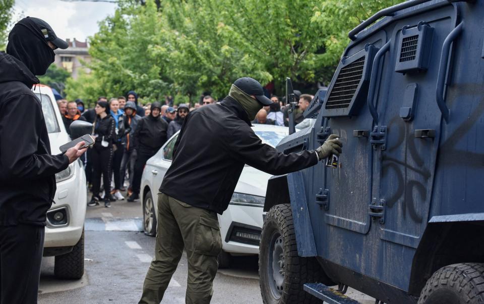 Protesters spray-painted Nato vehicles with the letter "Z", referring to a Russian emblem used in the war in Ukraine - REUTERS