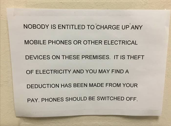 Sign stating: "Nobody is entitled to 'charge up' any mobile phones or other electrical devices on these premises. It is theft of electricity and you may find a deduction has been made from your pay. Phones should be switched off."