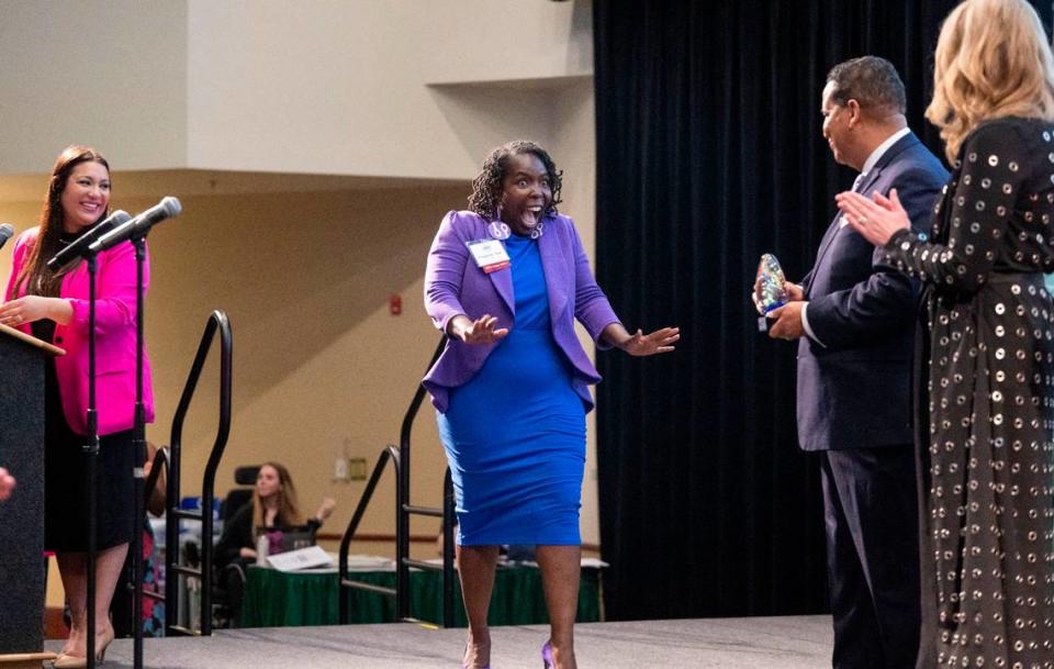 Sacramento Mayoral candidate Flojaune Cofer reacts with excitement as she enters the stage to get her award as The Bee celebrates 60 Sacramento change makers Friday.