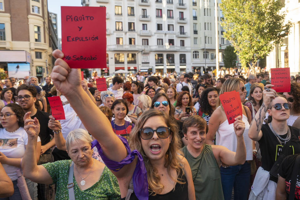 FILE - A demonstrator holds a red card reading in Spanish "Little pick and game over" during an anti-Rubiales protest and to support Spain player Jenni Hermoso in Madrid on Monday, Aug. 28, 2023. The kiss by Luis Rubiales has unleashed a storm of fury over gender equality that almost marred the unprecedented victory but now looks set to go down as a milestone in both Spanish soccer history but also in women's rights. (AP Photo/Andrea Comas, file)