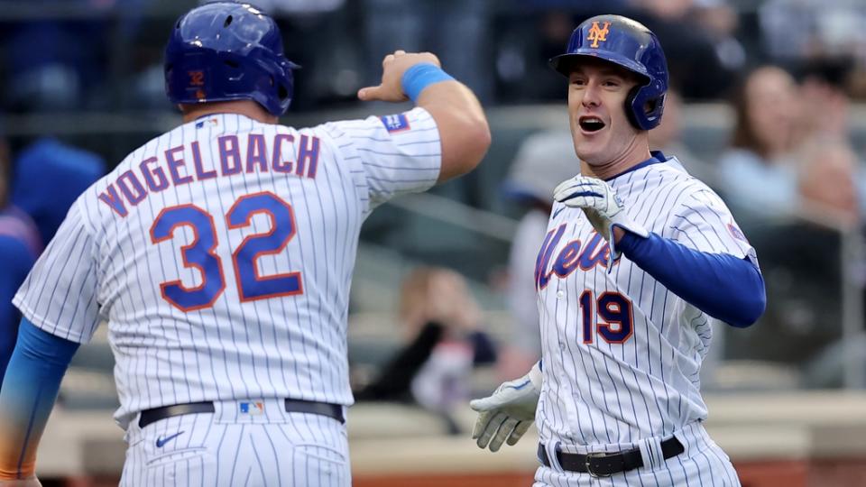 New York Mets left fielder Mark Canha (19) and designated hitter Daniel Vogelbach (32) react after scoring against the Atlanta Braves on a double by catcher Francisco Alvarez (not pictured) during the sixth inning at Citi Field