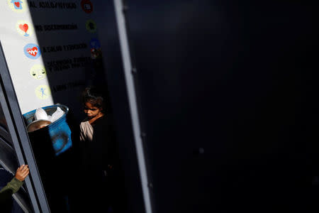 A girl, a member of a migrants caravan from Central America, leaves a shelter at the end of the caravan journey through Mexico, prior to preparations for an asylum request in the U.S., in Tijuana, Baja California state, Mexico April 26, 2018. REUTERS/Edgard Garrido