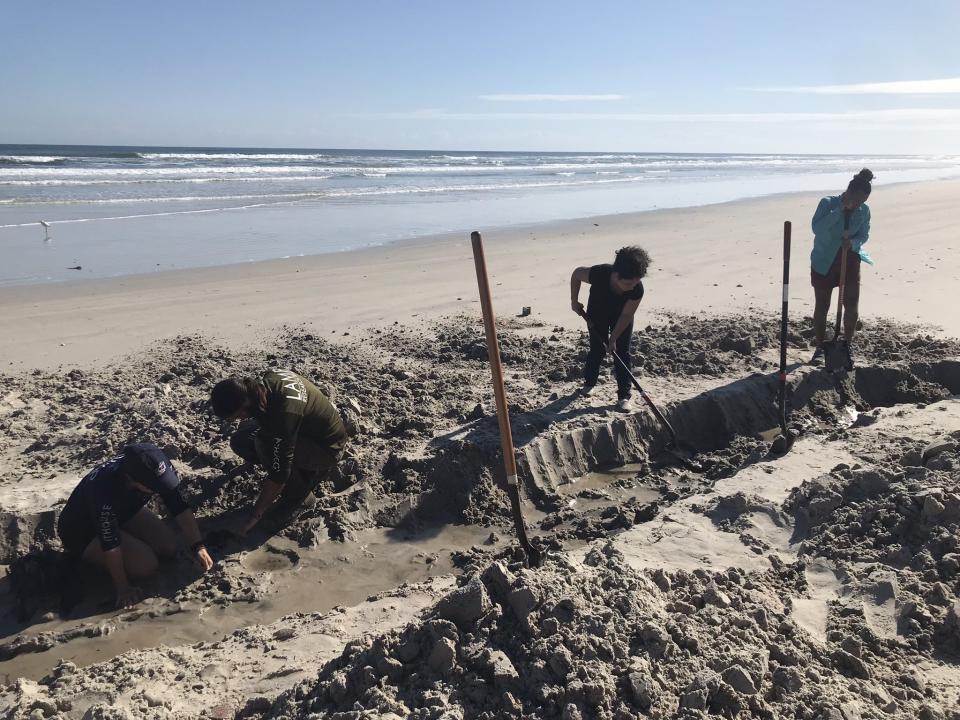 They think the object, which they believe was buried under more than 5 feet of sand just south of Frank Rendon Park, may be a cargo ship from the 1800s.