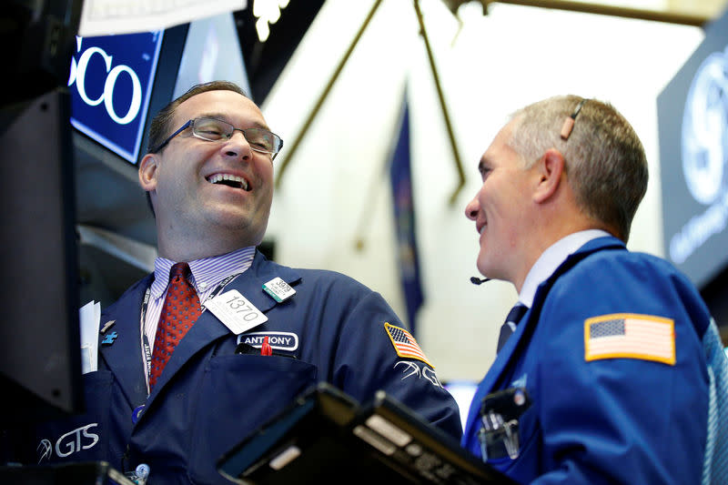 Traders work on the floor of the New York Stock Exchange (NYSE) in New York, U.S., August 14, 2017. REUTERS/Brendan McDermid