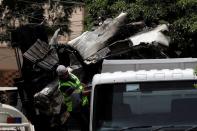 A truck is loaded with the wreckage of the crashed plane, in Karachi