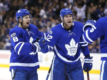 FILE PHOTO: Nov 8, 2017; Toronto, Ontario, CAN; Toronto Maple Leafs forward Josh Leivo (32) reacts after a goal by defenseman Connor Carrick (8) against the Minnesota Wild at the Air Canada Centre. Mandatory Credit: John E. Sokolowski-USA TODAY Sports