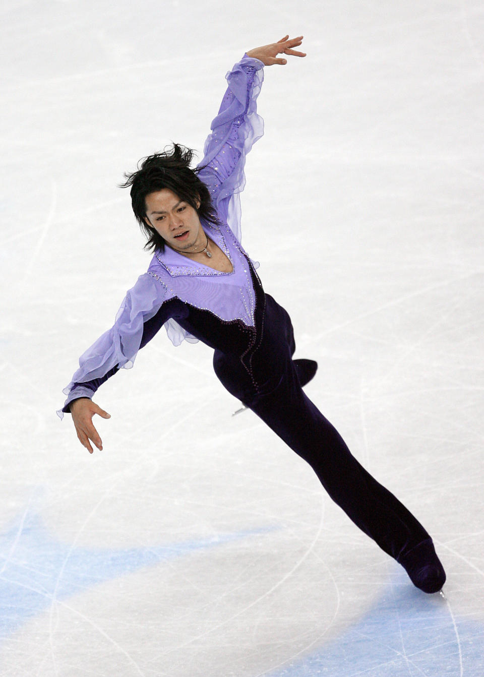 Japan's star performs in the men's free skating program in Turin, Italy.